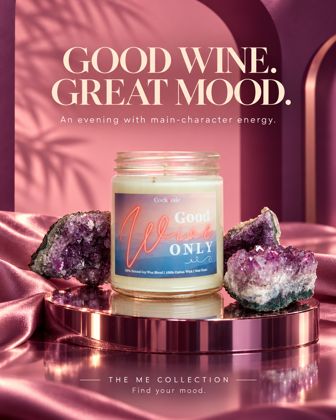 A jar candle displayed on a reflective metallic pedestal with purple crystal clusters around it. The candle jar has a cream-colored wax and a blue-to-pink gradient label reading 'Good Wine Only.